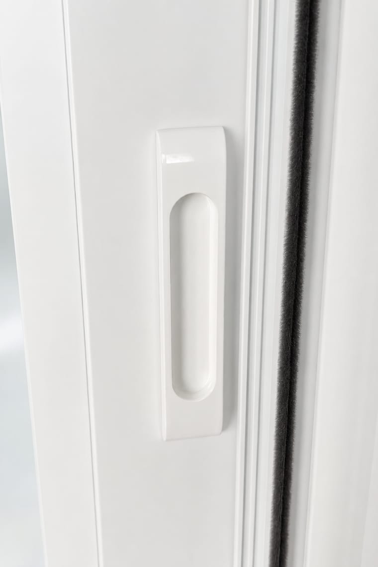 Before — White flush sliding door handle